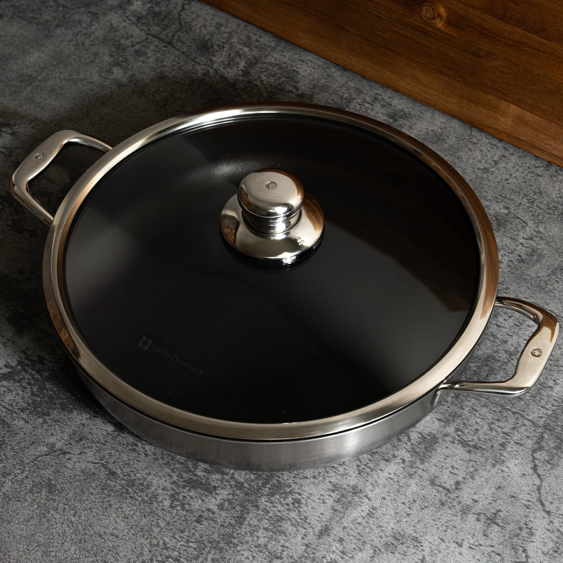 Nonstick Clad 5 L Stainless Chef's Pan with Glass Lid - Induction in use with lid on top and view from above on kitchen counter
