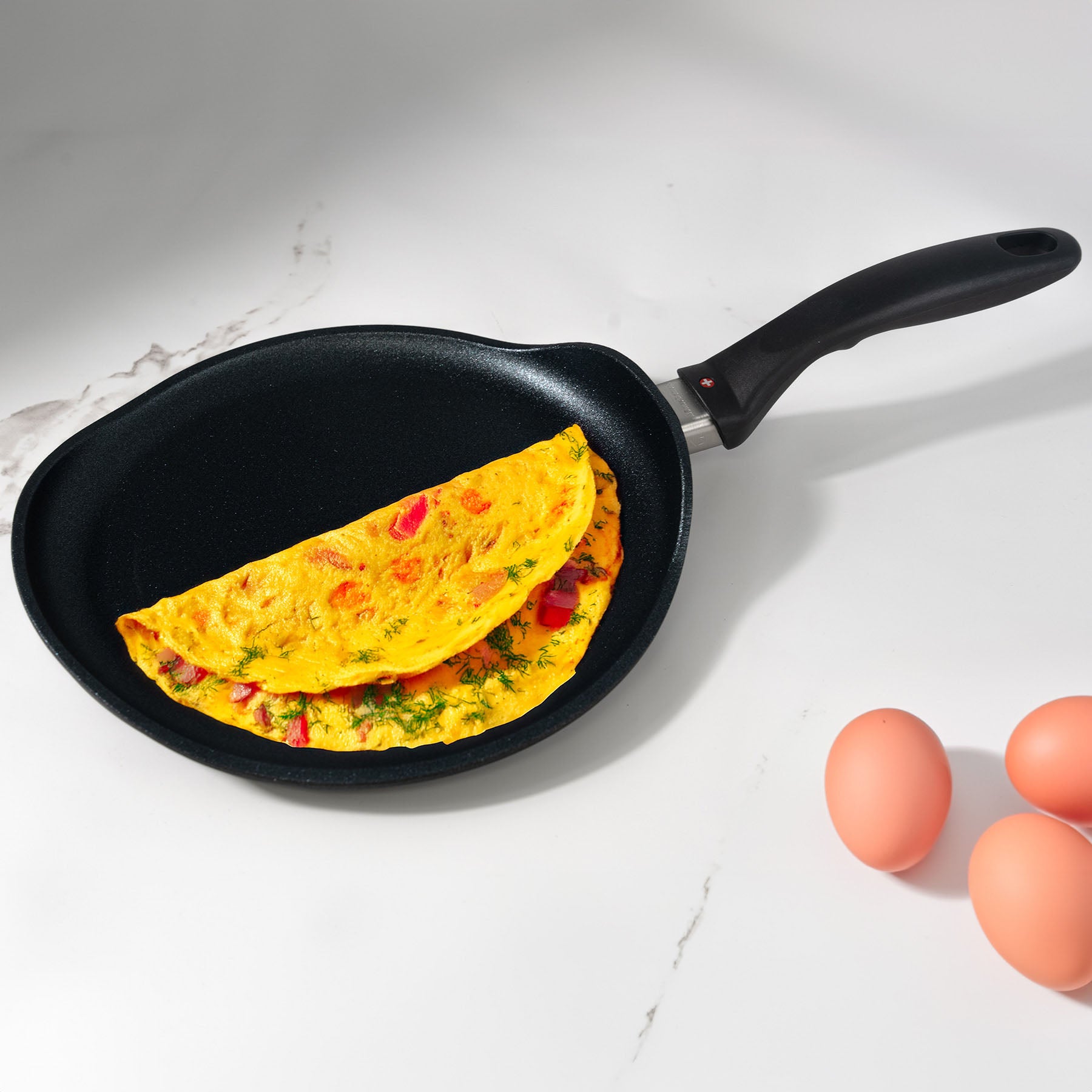 XD Nonstick 26 cm Crepe Pan - Induction on counter with food