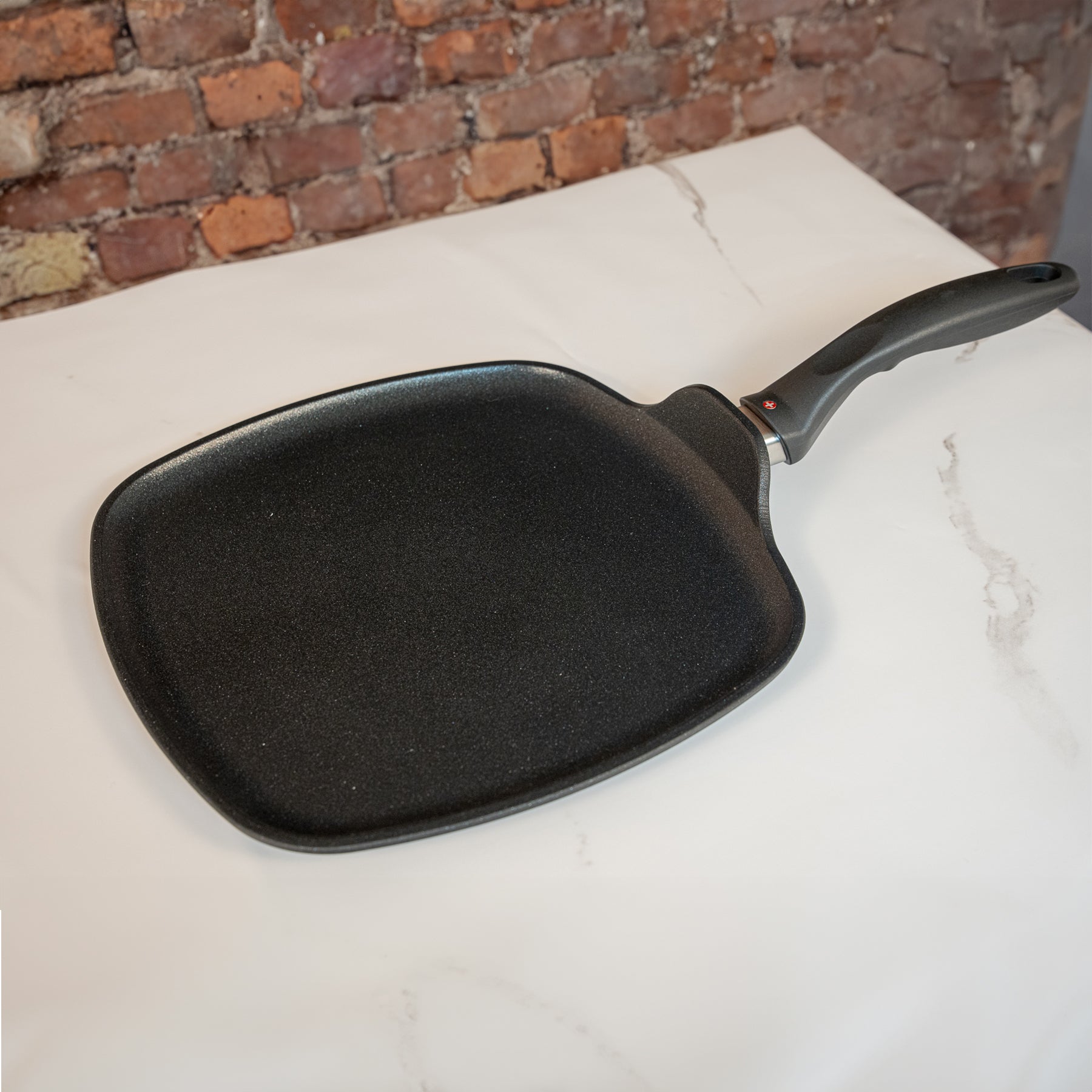 XD Nonstick 28 x 28 cm Square Griddle - Induction on white marble kitchen counter