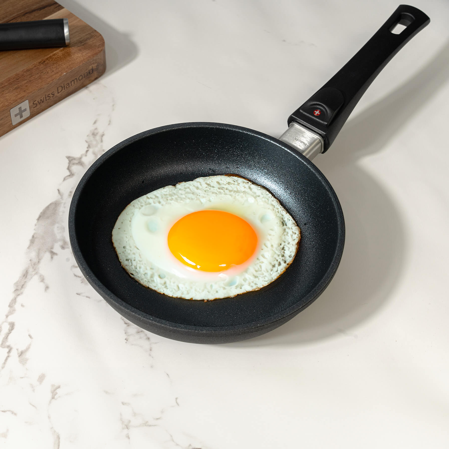 XD Nonstick 20 cm Fry Pan with Detachable Handle - Induction in use wit fried sunny side egg inside on kitchen counter