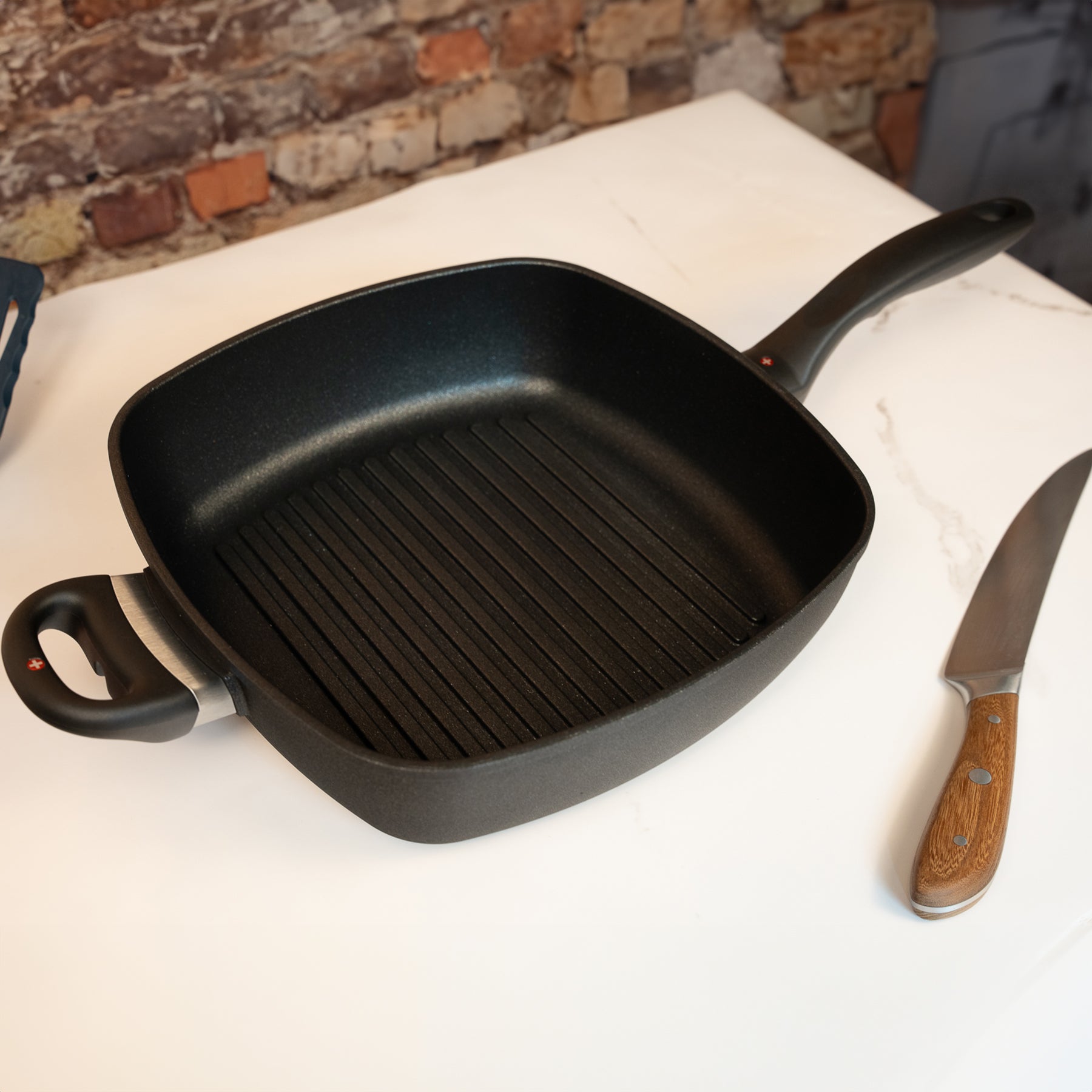 XD Nonstick 28 x 28 cm Deep Square Grill Pan - Induction in use on marble countertop