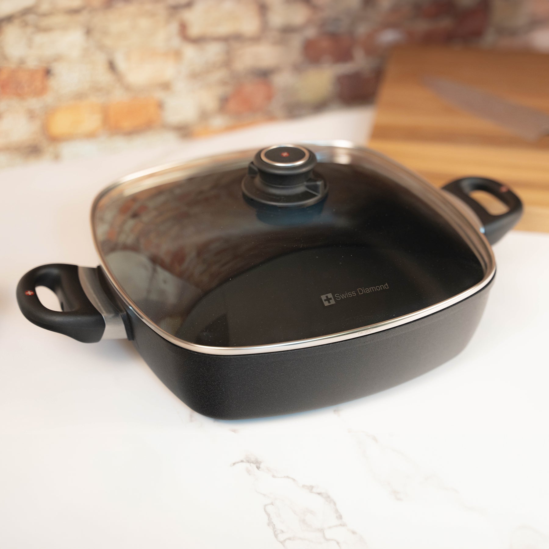 XD Nonstick 5 qt Square Casserole with Glass Lid in use on kitchen countertop