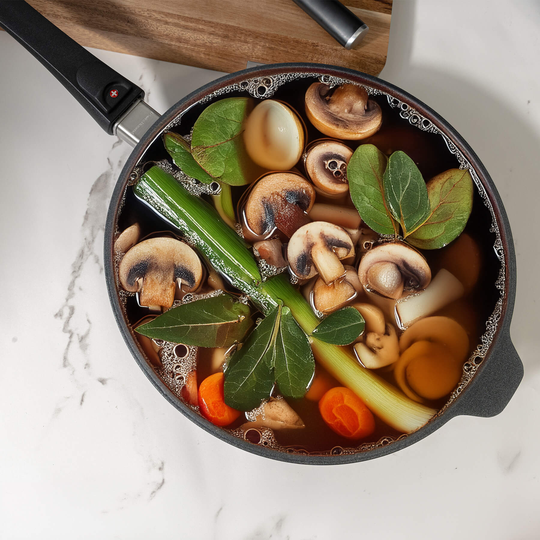 XD Nonstick 3 L Saute Pan with Detachable Handle - Induction in use with food in side on kitchen counter