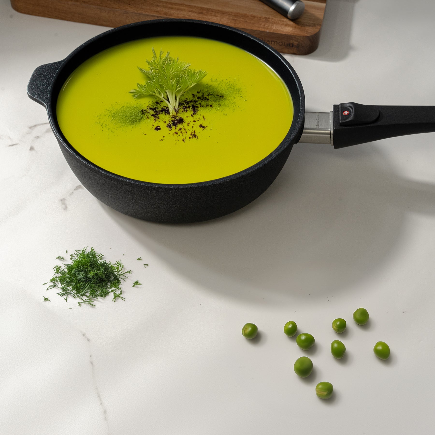 XD Nonstick 4 L Saute Pan with Detachable Handle - Induction in use with soup inside on kitchen counter