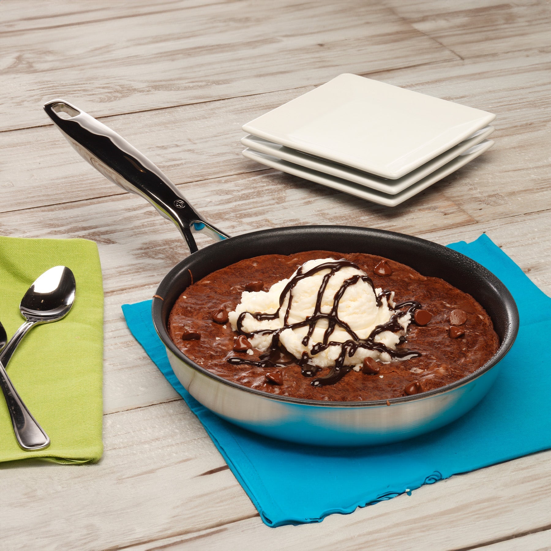 Nonstick Clad Fry Pan - Induction in use on wooden table