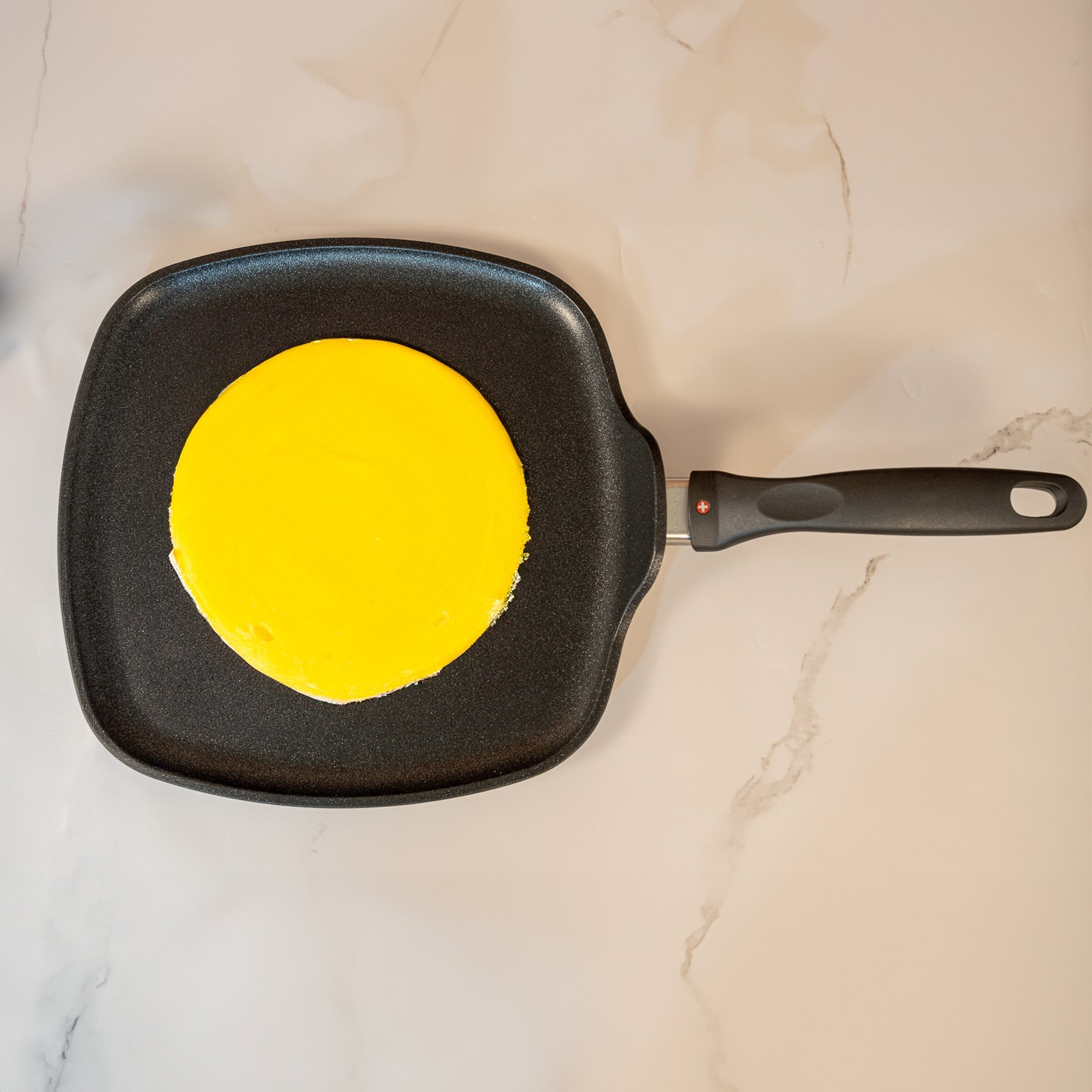 XD Nonstick 28 x 28 cm Square Griddle - Induction in use with crepe on surface