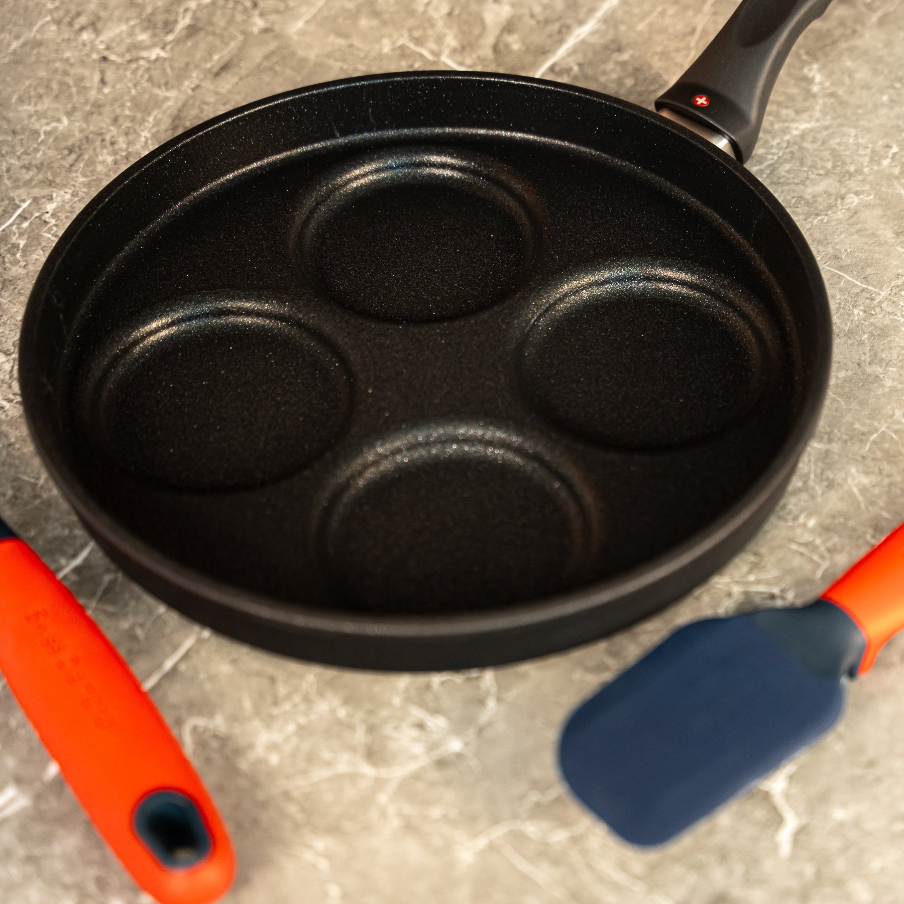 XD Nonstick 10.25" Plett Pan in use on marble counter top