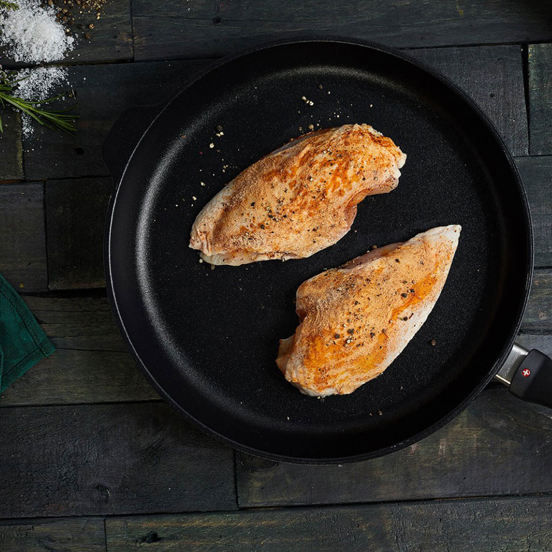 XD Nonstick Fry Pan in use on wooden table