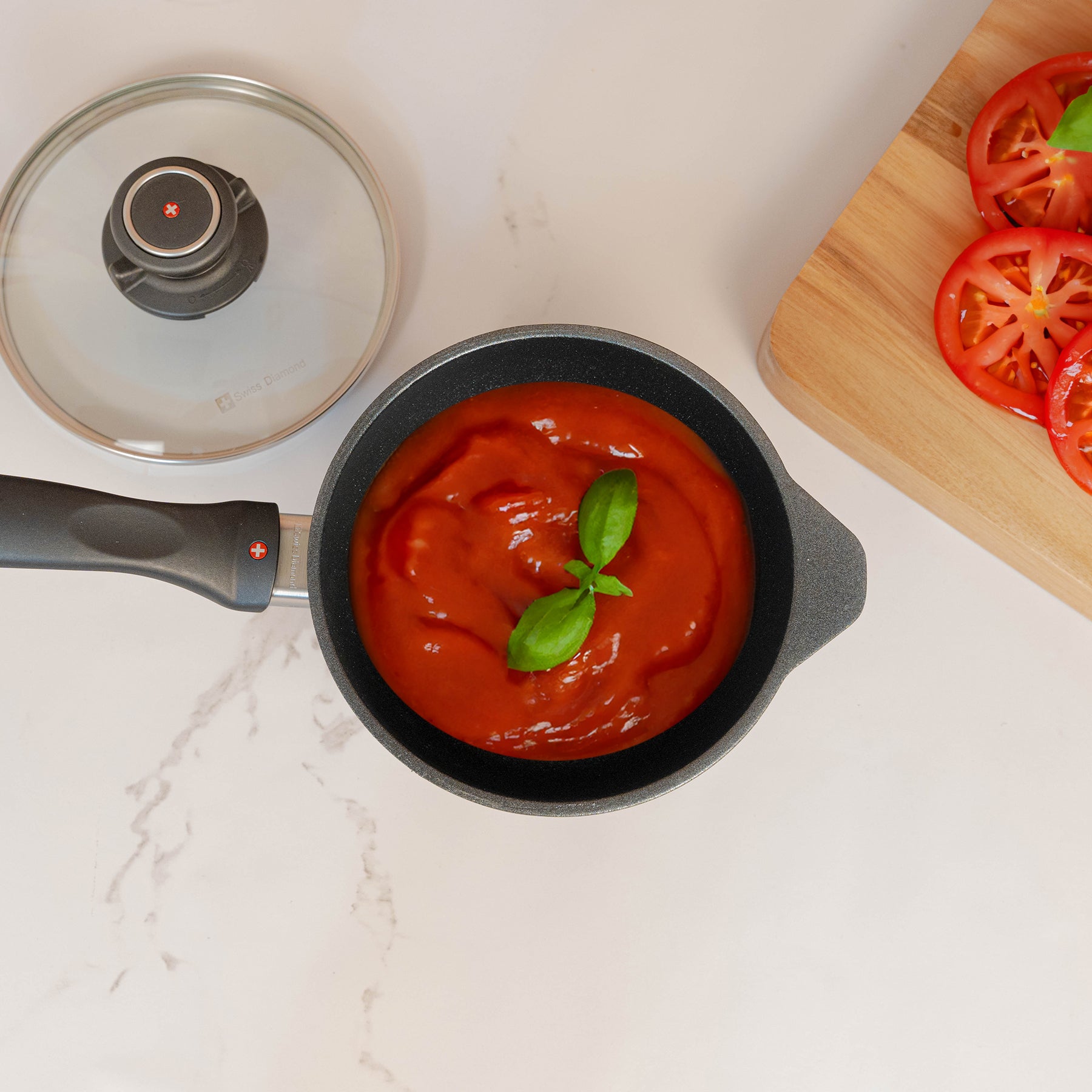 XD Nonstick Saucepan with Glass Lid top view of sauce in pan on kitchen counter