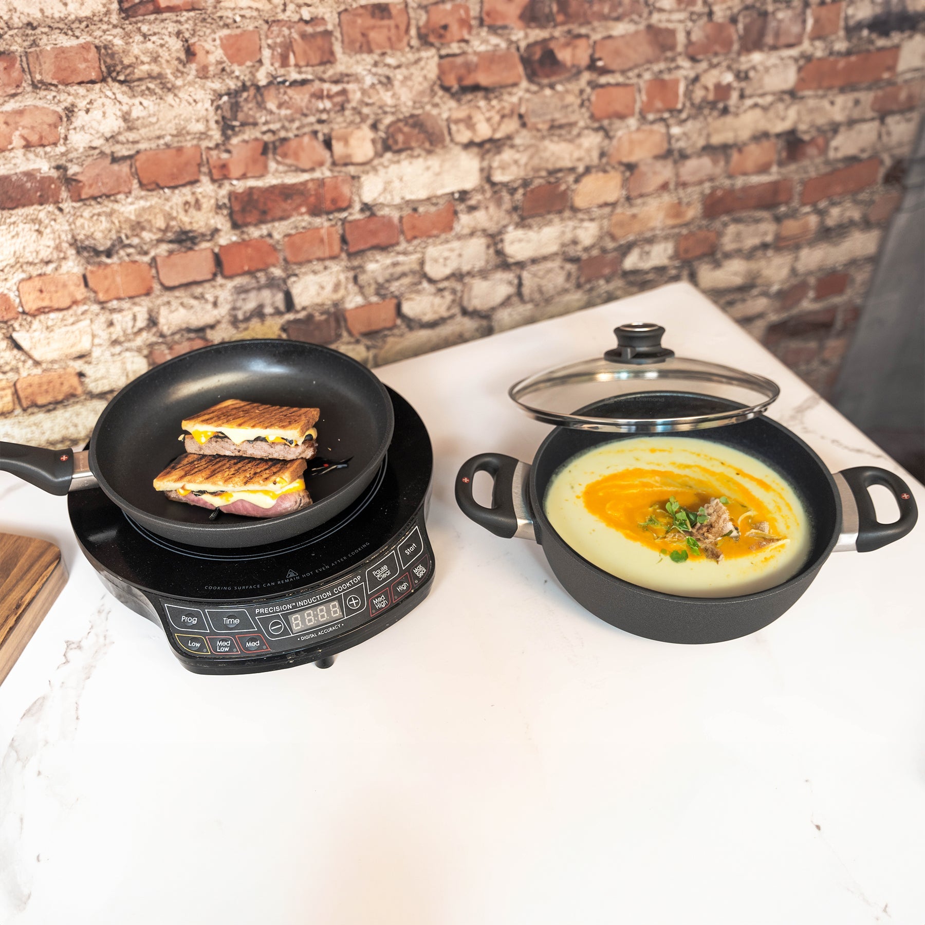 XD Nonstick 3-Piece Set - Fry Pan & Casserole - Induction in use with food cooking on hotplate