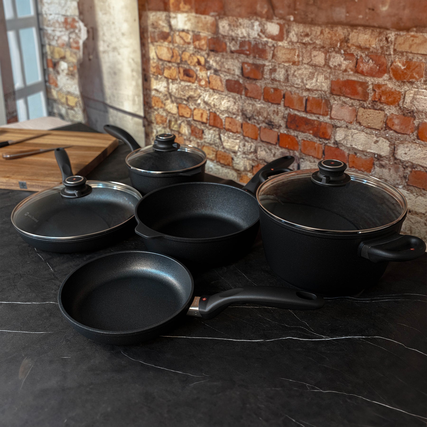 XD Nonstick 9-Piece Set - Kitchen Essentials side view sitting on a black marble countertop